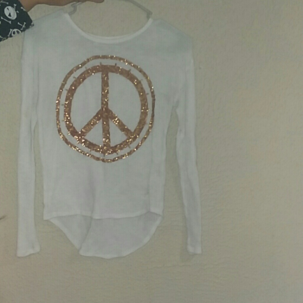 White sweater with gold peace sign